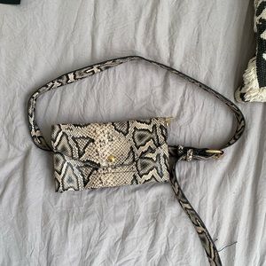 snake skin purse that also has a strap for a fanny pack